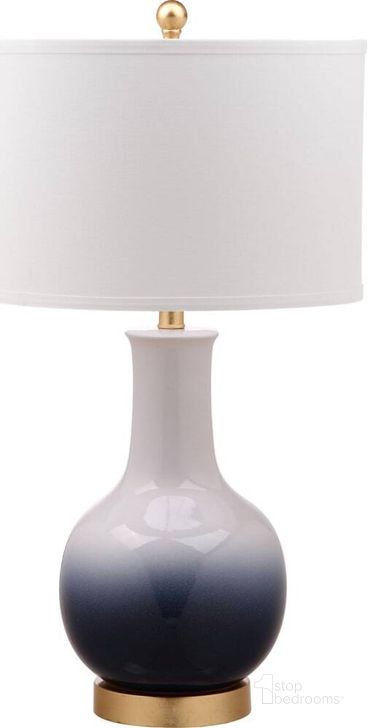 The appearance of Alfio Navy/White Table Lamp designed by Safavieh in the modern / contemporary interior design. This white navy piece of furniture  was selected by 1StopBedrooms from Alfio Collection to add a touch of cosiness and style into your home. Sku: TBL4032B. Product Type: Table Lamp. Image1