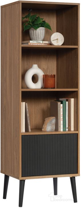 The appearance of Ambleside Bookcase With Door In Serene Walnut designed by Sauder in the modern / contemporary interior design. This serene walnut piece of furniture  was selected by 1StopBedrooms from Ambleside Collection to add a touch of cosiness and style into your home. Sku: 431620. Product Type: Bookcase. Material: Engineered Wood. Image1