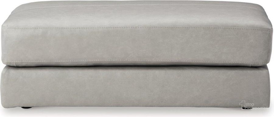 The appearance of Amiata Oversized Accent Ottoman In Glacier designed by Signature Design by Ashley in the modern / contemporary interior design. This glacier piece of furniture  was selected by 1StopBedrooms from Amiata Collection to add a touch of cosiness and style into your home. Sku: 5740408. Product Type: Ottoman. Material: Leather Match. Image1