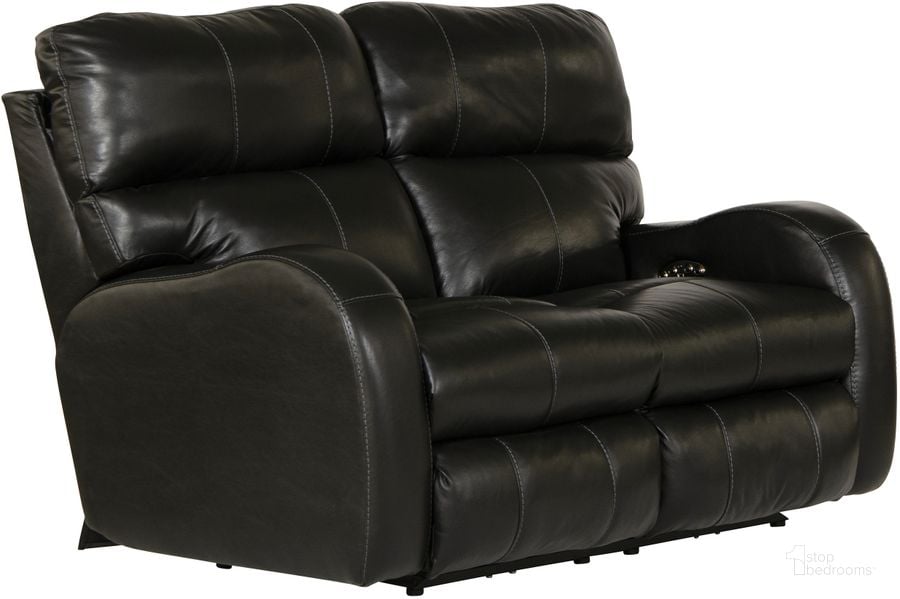 The appearance of Angelo Italian Leather Match Power Reclining Loveseat with Power Adjustable Headrest In Black designed by Catnapper in the traditional interior design. This black piece of furniture  was selected by 1StopBedrooms from Angelo Collection to add a touch of cosiness and style into your home. Sku: 64462127388307388. Material: Leather Match. Product Type: Reclining Loveseat. Image1
