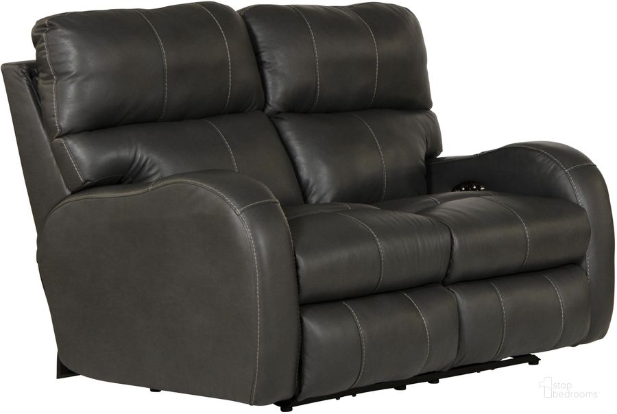The appearance of Angelo Italian Leather Match Power Reclining Loveseat with Power Adjustable Headrest In Gunmetal designed by Catnapper in the traditional interior design. This gunmetal piece of furniture  was selected by 1StopBedrooms from Angelo Collection to add a touch of cosiness and style into your home. Sku: 64462127358307358. Material: Leather Match. Product Type: Reclining Loveseat. Image1