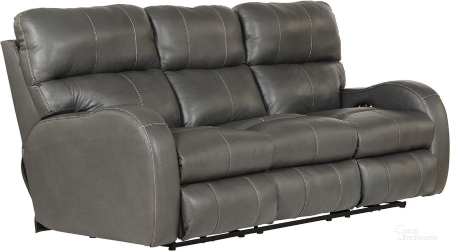 The appearance of Angelo Italian Leather Match Power Reclining Sofa with Power Adjustable Headrest In Gunmetal designed by Catnapper in the traditional interior design. This gunmetal piece of furniture  was selected by 1StopBedrooms from Angelo Collection to add a touch of cosiness and style into your home. Sku: 64461127358307358. Material: Leather Match. Product Type: Reclining Sofa. Image1