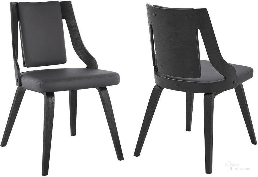 The appearance of Aniston Gray Faux Leather And Black Wood Dining Chair designed by Armen Living in the modern / contemporary interior design. This black piece of furniture  was selected by 1StopBedrooms from Aniston Collection to add a touch of cosiness and style into your home. Sku: LCANSIBLGR. Material: Wood. Product Type: Dining Chair. Image1