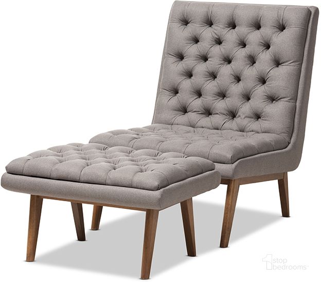 The appearance of Annetha Mid-Century Modern Grey Fabric Upholstered Walnut Finished Wood Chair And Ottoman Set designed by Baxton Studio in the transitional interior design. This grey piece of furniture  was selected by 1StopBedrooms from Annetha Collection to add a touch of cosiness and style into your home. Sku: BBT5272-Grey Set. Product Type: Living Room Set. Material: Rubberwood. Image1