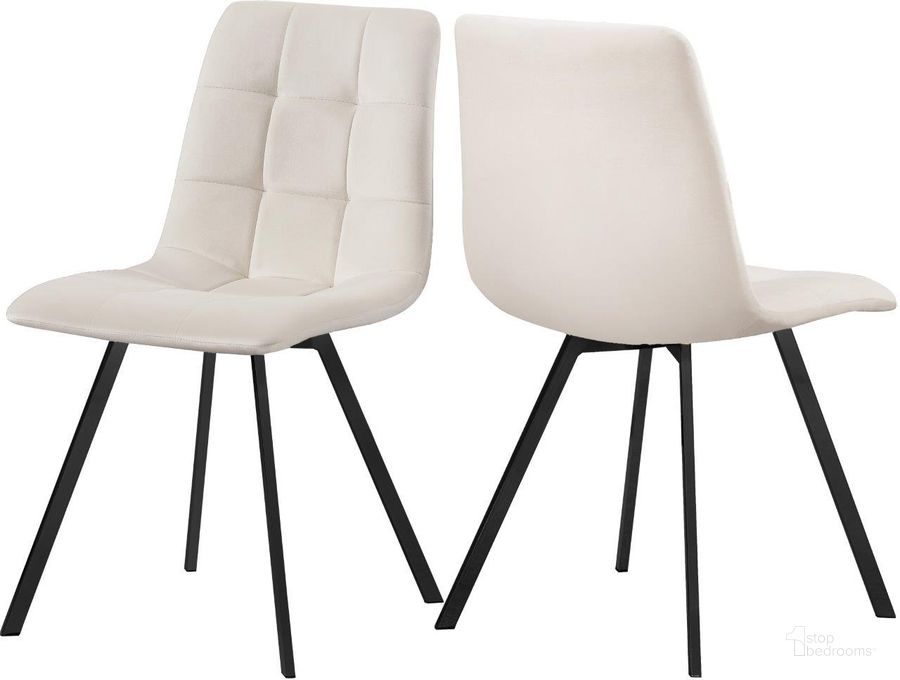The appearance of Annie Cream Velvet Dining Chair Set of 2 designed by Meridian in the modern / contemporary interior design. This cream velvet piece of furniture  was selected by 1StopBedrooms from Annie Collection to add a touch of cosiness and style into your home. Sku: 981Cream-C. Product Type: Dining Chair. Material: Velvet. Image1