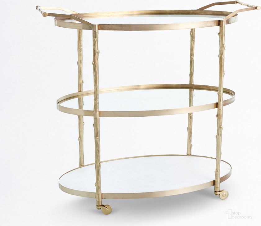 The appearance of Arbor Bar Cart In Brass designed by Global Views in the modern / contemporary interior design. This brass piece of furniture  was selected by 1StopBedrooms from Arbor Collection to add a touch of cosiness and style into your home. Sku: 8.82047. Product Type: Bar Cart. Material: Iron. Image1