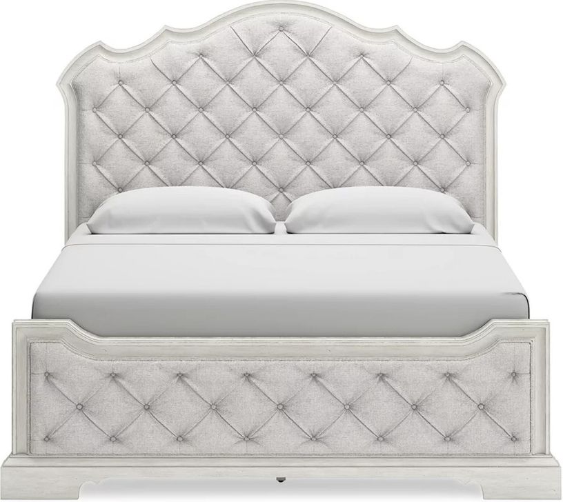 The appearance of Arlendyne California King Upholstered Bed In Antique White designed by Signature Design by Ashley in the traditional interior design. This antique white piece of furniture  was selected by 1StopBedrooms from Arlendyne Collection to add a touch of cosiness and style into your home. Sku: B980-56;B980-58;B980-94. Bed Type: Panel Bed. Material: Fabric. Product Type: Panel Bed. Bed Size: California King. Image1