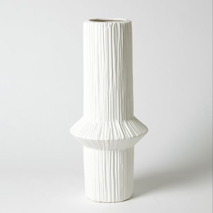 The appearance of Ascending Ring Low Vase In Matte White designed by Global Views in the modern / contemporary interior design. This white piece of furniture  was selected by 1StopBedrooms from Ascending Collection to add a touch of cosiness and style into your home. Sku: 7.30133. Material: Ceramic. Product Type: Vase. Image1