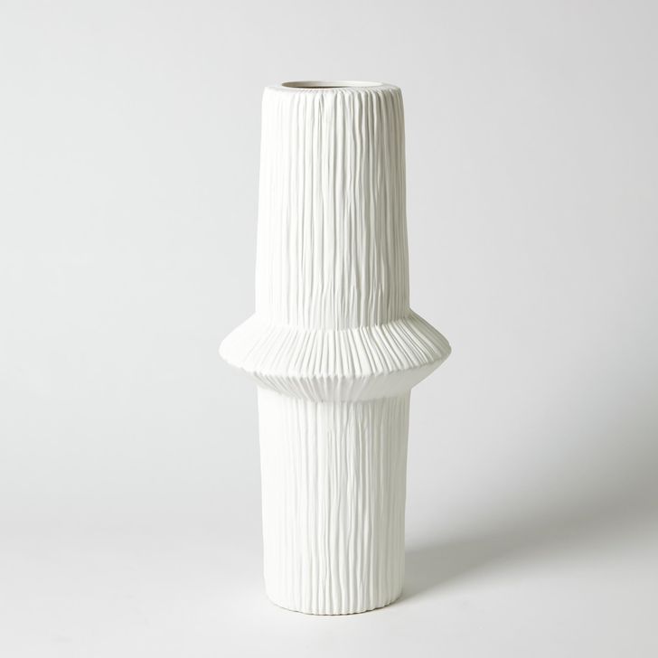 The appearance of Ascending Ring Medium Vase In Matte White designed by Global Views in the modern / contemporary interior design. This white piece of furniture  was selected by 1StopBedrooms from Ascending Collection to add a touch of cosiness and style into your home. Sku: 7.30132. Material: Ceramic. Product Type: Vase. Image1