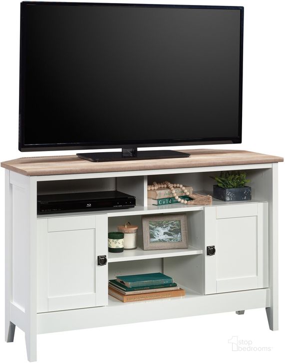 The appearance of August Hill Corner Tv Stand In Soft White designed by Sauder in the country / farmhouse interior design. This soft white piece of furniture  was selected by 1StopBedrooms from August Hill Collection to add a touch of cosiness and style into your home. Sku: 433851. Product Type: TV Stand. Material: Engineered Wood. Image1
