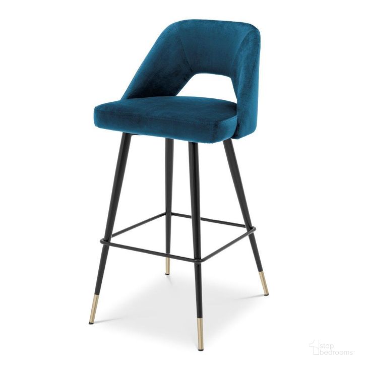 The appearance of Bar Stool In Avorio Roche Blue Velvet designed by Eichholtz in the modern / contemporary interior design. This blue piece of furniture  was selected by 1StopBedrooms from Avorio Collection to add a touch of cosiness and style into your home. Sku: A112056. Product Type: Barstool. Material: Velvet. Image1