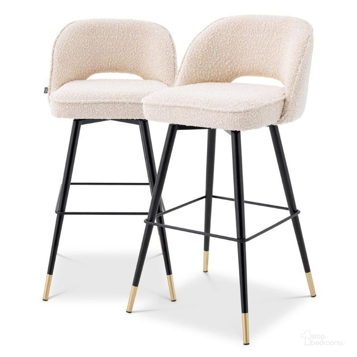 The appearance of Bar Stool In Cliff Boucle Cream Set Of 2 designed by Eichholtz in the modern / contemporary interior design. This cream piece of furniture  was selected by 1StopBedrooms from Cliff Collection to add a touch of cosiness and style into your home. Sku: A114648. Material: Fabric. Product Type: Barstool. Image1