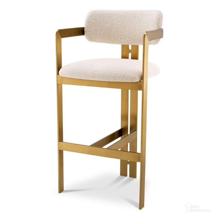 The appearance of Bar Stool In Donato Brushed Brass Finish Boucle Cream designed by Eichholtz in the modern / contemporary interior design. This brass piece of furniture  was selected by 1StopBedrooms from Donato Collection to add a touch of cosiness and style into your home. Sku: A115048. Material: Fabric. Product Type: Barstool. Image1
