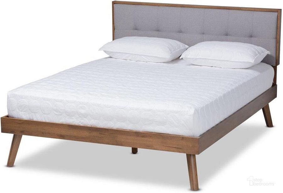 The appearance of Baxton Studio Alke Mid-Century Modern Light Grey Fabric Upholstered Walnut Brown Finished Wood Full Size Platform Bed designed by Baxton Studio in the transitional interior design. This light grey piece of furniture  was selected by 1StopBedrooms from Alke Collection to add a touch of cosiness and style into your home. Sku: SW8180-Light Grey/Walnut-M17-Full. Bed Type: Platform Bed. Product Type: Platform Bed. Bed Size: Full. Material: Rubberwood. Image1