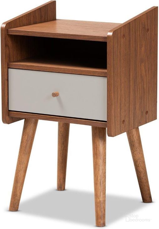 The appearance of Baxton Studio Elario Mid Century Modern Two Tone Grey And Walnut Brown Finished Wood 1 Drawer Nightstand designed by Baxton Studio in the transitional interior design. This grey and walnut piece of furniture  was selected by 1StopBedrooms from Elario Collection to add a touch of cosiness and style into your home. Sku: FP-11019-Grey/Walnut-NS. Product Type: Nightstand. Material: Rubberwood. Image1