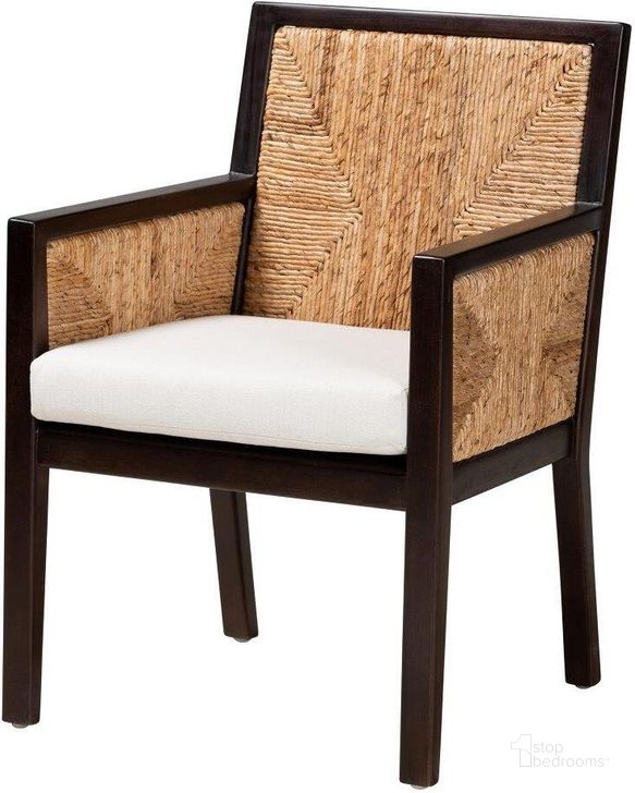 The appearance of Baxton Studio Joana Modern Bohemian Dark Brown Mahogany Wood and Natural Abaca Dining Arm Chair designed by Baxton Studio in the coastal interior design. This brown white piece of furniture  was selected by 1StopBedrooms from Joana Collection to add a touch of cosiness and style into your home. Sku: Joana-Mahogany-AC. Material: Wood. Product Type: Dining Chair. Image1