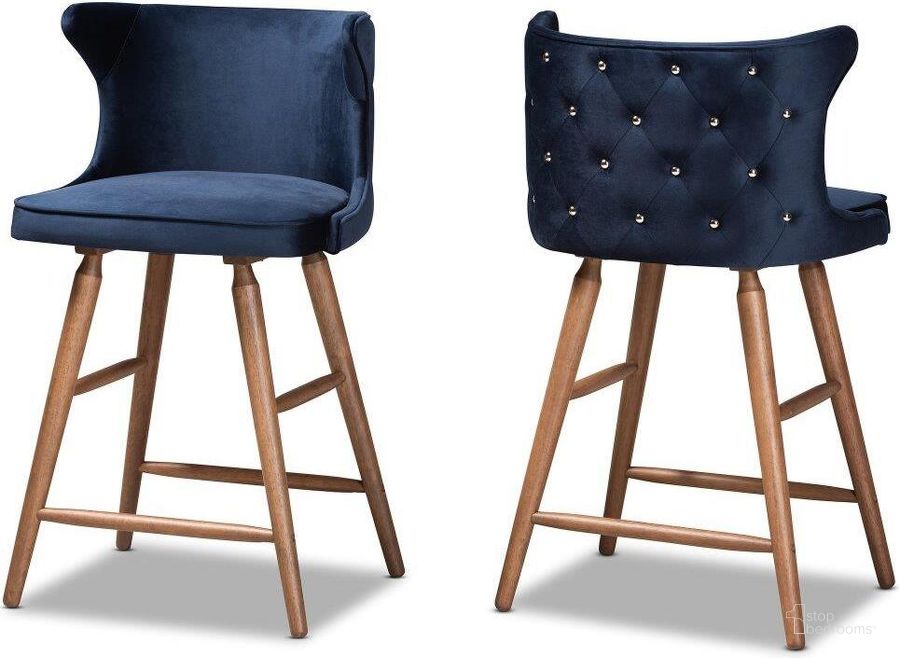 The appearance of Sagira Modern And Contemporary Transitional Navy Blue Velvet Fabric Upholstered And Walnut Brown Finished Wood 2-Piece Counter Stool Set designed by Baxton Studio in the modern / contemporary interior design. This navy blue piece of furniture  was selected by 1StopBedrooms from Sagira Collection to add a touch of cosiness and style into your home. Sku: RDC817-AC-Navy Blue Velvet/Walnut-CS-2PC Set. Material: Wood. Product Type: Barstool. Image1