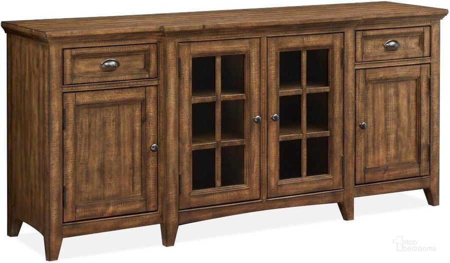 The appearance of Bay Creek Toasted Nutmeg Wood 70 Inch Console designed by Magnussen in the modern / contemporary interior design. This brown piece of furniture  was selected by 1StopBedrooms from Bay Creek Collection to add a touch of cosiness and style into your home. Sku: E4398-05. Product Type: Entertainment Console. Image1