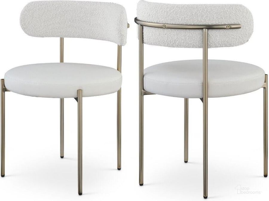 The appearance of Beacon Cream Faux Leather And Boucle Fabric Dining Chair Set of 2 886Cream-C designed by Meridian in the modern / contemporary interior design. This taupe piece of furniture  was selected by 1StopBedrooms from Beacon Collection to add a touch of cosiness and style into your home. Sku: 886Cream-C. Product Type: Dining Chair. Material: Iron. Image1