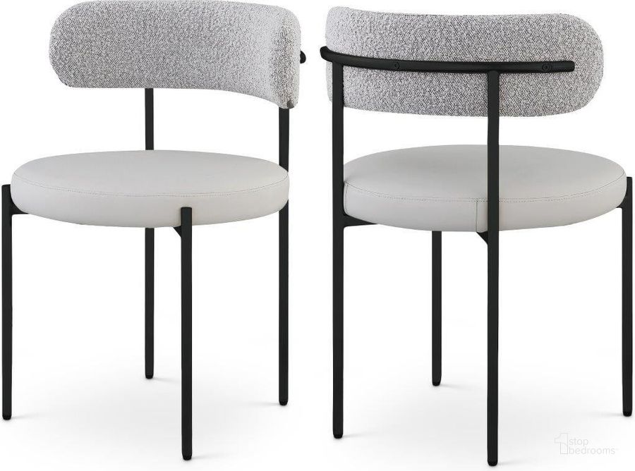 The appearance of Beacon Taupe Faux Leather And Boucle Fabric Dining Chair Set of 2 881Taupe-C designed by Meridian in the modern / contemporary interior design. This white and black piece of furniture  was selected by 1StopBedrooms from Beacon Collection to add a touch of cosiness and style into your home. Sku: 881Taupe-C. Product Type: Dining Chair. Material: Iron. Image1