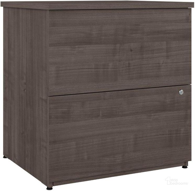 The appearance of Bestar Logan 28W 2 Drawer Lateral File Cabinet In Medium Gray Maple designed by Bestar in the modern / contemporary interior design. This gray piece of furniture  was selected by 1StopBedrooms from Logan Collection to add a touch of cosiness and style into your home. Sku: 146600-000141. Material: Wood. Product Type: Lateral Filing Cabinet. Image1