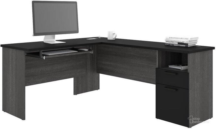The appearance of Bestar Norma L-Shaped Desk - Black and Bark Gray designed by Bestar in the modern / contemporary interior design. This black piece of furniture  was selected by 1StopBedrooms from Norma Collection to add a touch of cosiness and style into your home. Sku: 181420-000018. Material: Wood. Product Type: Desk. Image1