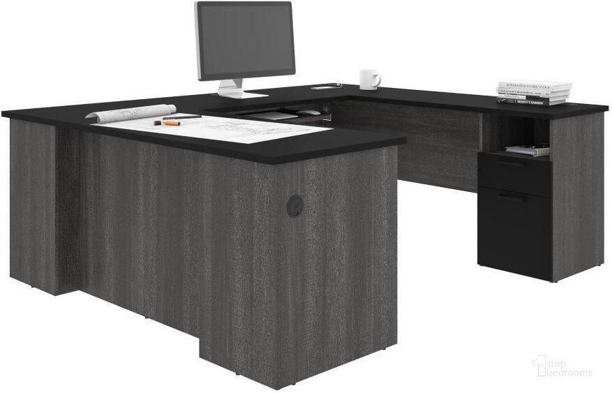 The appearance of Bestar Norma U-shaped Desk - Black and Bark Gray designed by Bestar in the modern / contemporary interior design. This black piece of furniture  was selected by 1StopBedrooms from Norma Collection to add a touch of cosiness and style into your home. Sku: 181851-000018. Material: Wood. Product Type: Desk. Image1