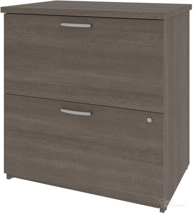 The appearance of Bestar Universel 29W Lateral File Cabinet In Bark Grey designed by Bestar in the modern / contemporary interior design. This bark gray piece of furniture  was selected by 1StopBedrooms from Universel Collection to add a touch of cosiness and style into your home. Sku: 46630-1147. Material: Wood. Product Type: Lateral Filing Cabinet. Image1