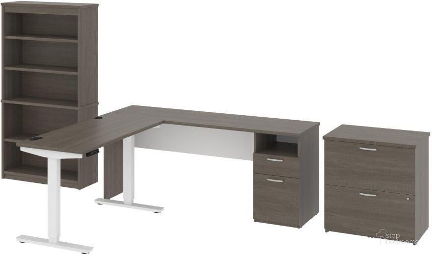 The appearance of Bestar Upstand 135W 72W L-Shaped Standing Desk With Bookcase And File Cabinet In Bark Grey & White designed by Bestar in the modern / contemporary interior design. This bark gray piece of furniture  was selected by 1StopBedrooms from Upstand Collection to add a touch of cosiness and style into your home. Sku: 175853-000047. Material: Wood. Product Type: Home Office Set. Image1
