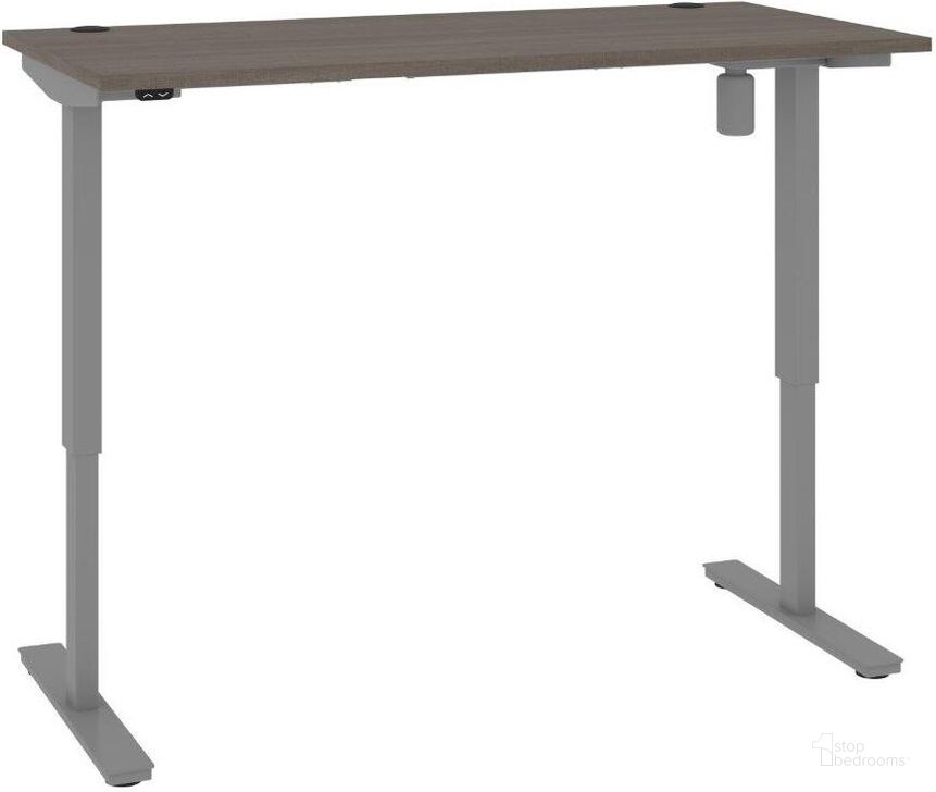 The appearance of Bestar Upstand 30 x 60 Standing Desk In Bark Grey designed by Bestar in the modern / contemporary interior design. This bark gray piece of furniture  was selected by 1StopBedrooms from Upstand Collection to add a touch of cosiness and style into your home. Sku: 175869-000047. Material: Wood. Product Type: Desk. Image1