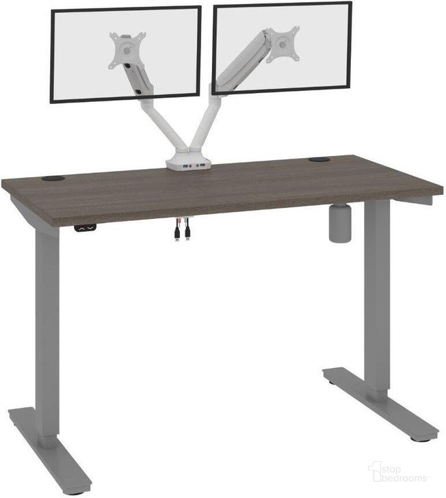 The appearance of Bestar Upstand Standing Desk With Dual Monitor Arm In Bark Grey 175860-000047 designed by Bestar in the modern / contemporary interior design. This grey piece of furniture  was selected by 1StopBedrooms from Upstand Collection to add a touch of cosiness and style into your home. Sku: 175860-000047. Material: Wood. Product Type: Desk. Image1