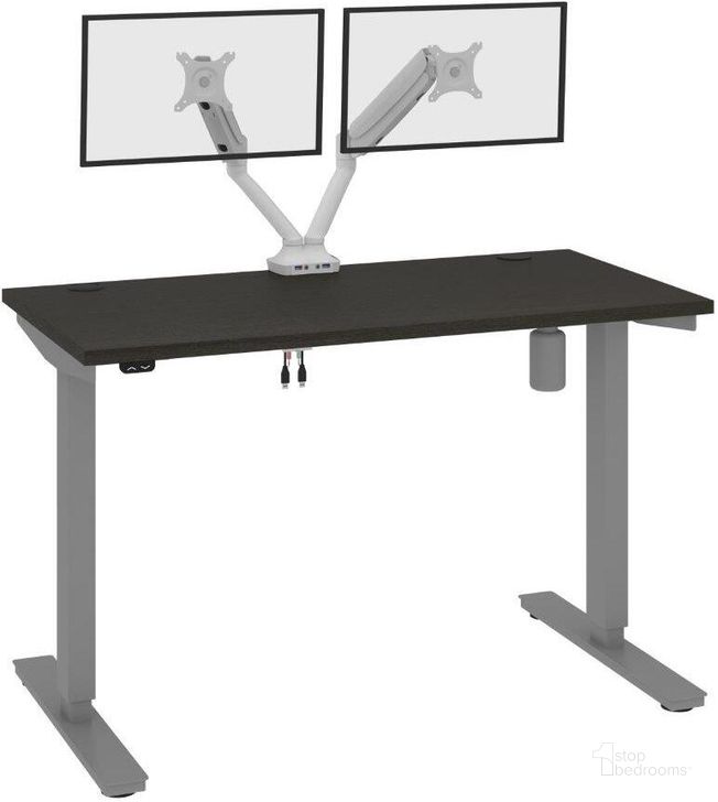 The appearance of Bestar Upstand Standing Desk With Dual Monitor Arm In Deep Grey 175860-000032 designed by Bestar in the modern / contemporary interior design. This deep grey piece of furniture  was selected by 1StopBedrooms from Upstand Collection to add a touch of cosiness and style into your home. Sku: 175860-000032. Material: Wood. Product Type: Desk. Image1