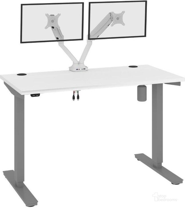 The appearance of Bestar Upstand Standing Desk With Dual Monitor Arm In White 175860-000017 designed by Bestar in the modern / contemporary interior design. This white piece of furniture  was selected by 1StopBedrooms from Upstand Collection to add a touch of cosiness and style into your home. Sku: 175860-000017. Material: Wood. Product Type: Desk. Image1