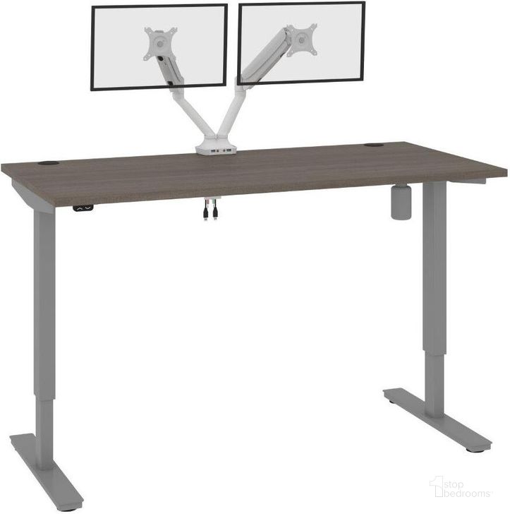 The appearance of Bestar Upstand Standing Desk With Dual Monitor Arm In Bark Grey 175870-000047 designed by Bestar in the modern / contemporary interior design. This grey piece of furniture  was selected by 1StopBedrooms from Upstand Collection to add a touch of cosiness and style into your home. Sku: 175870-000047. Material: Wood. Product Type: Desk. Image1