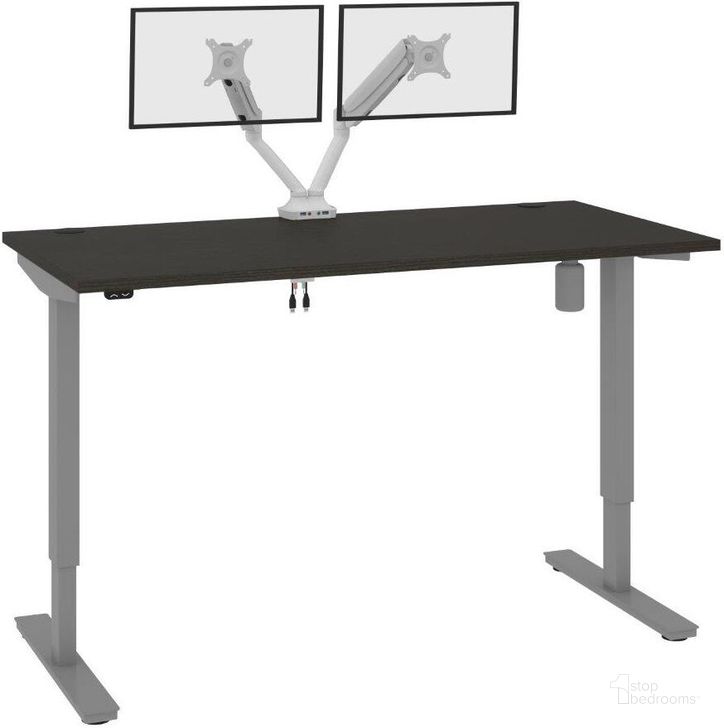 The appearance of Bestar Upstand Standing Desk With Dual Monitor Arm In Deep Grey 175870-000032 designed by Bestar in the modern / contemporary interior design. This deep grey piece of furniture  was selected by 1StopBedrooms from Upstand Collection to add a touch of cosiness and style into your home. Sku: 175870-000032. Material: Wood. Product Type: Desk. Image1