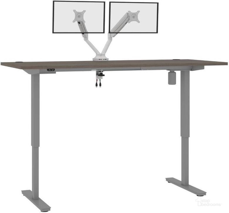 The appearance of Bestar Upstand Standing Desk With Dual Monitor Arm In Bark Grey 175880-000047 designed by Bestar in the modern / contemporary interior design. This grey piece of furniture  was selected by 1StopBedrooms from Upstand Collection to add a touch of cosiness and style into your home. Sku: 175880-000047. Material: Wood. Product Type: Desk. Image1