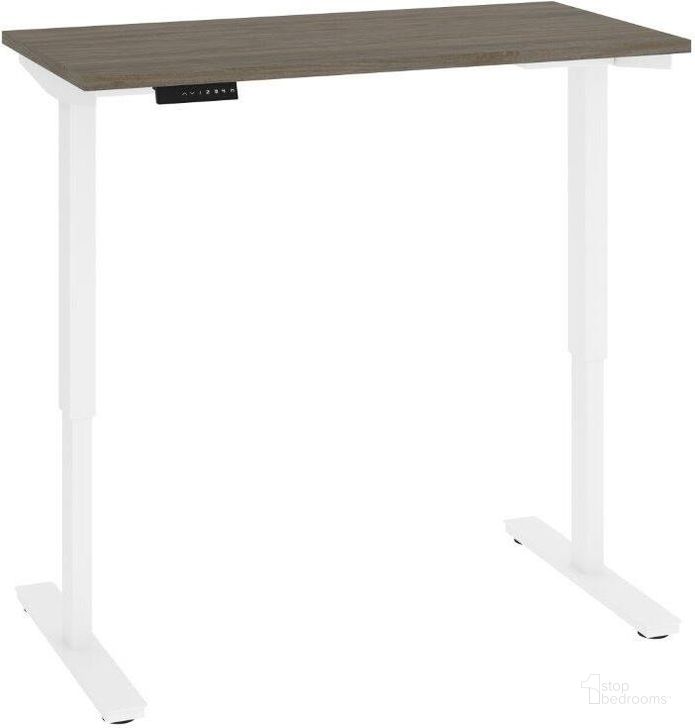 The appearance of Bestar Viva 48W x 24D Electric Standing Desk In Walnut Grey designed by Bestar in the modern / contemporary interior design. This walnut gray piece of furniture  was selected by 1StopBedrooms from Viva Collection to add a touch of cosiness and style into your home. Sku: 19857-000035. Material: Wood. Product Type: Desk. Image1