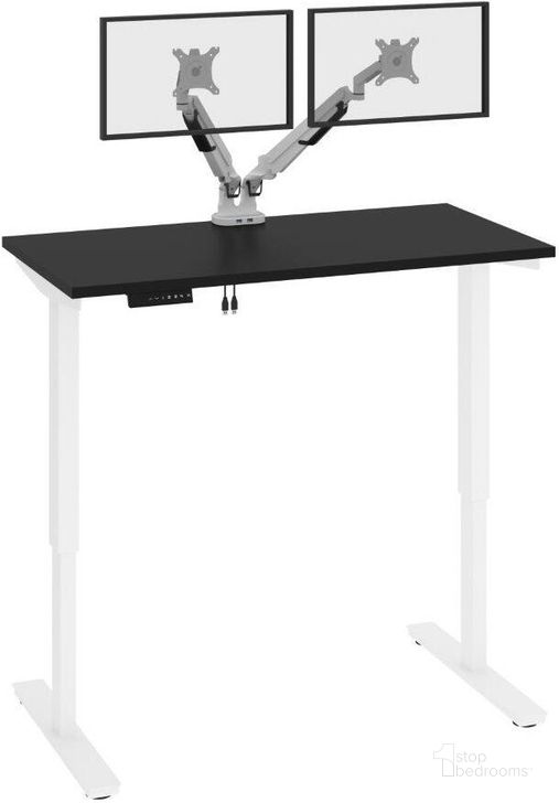 The appearance of Bestar Viva 48W x 24D Electric Standing Desk With Monitor Arms In Black designed by Bestar in the modern / contemporary interior design. This black piece of furniture  was selected by 1StopBedrooms from Viva Collection to add a touch of cosiness and style into your home. Sku: 19858-000018. Material: Wood. Product Type: Desk. Image1