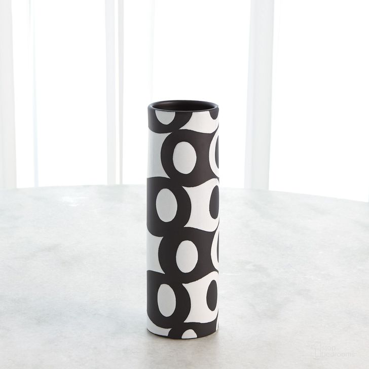 The appearance of Black And White Circles Small Vase In Black designed by Global Views in the modern / contemporary interior design. This black piece of furniture  was selected by 1StopBedrooms from Circle Collection to add a touch of cosiness and style into your home. Sku: 3.31648. Material: Ceramic. Product Type: Vase. Image1