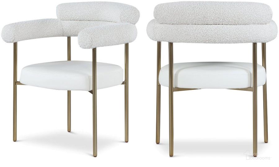 The appearance of Blake Cream Faux Leather And Boucle Fabric Dining Chair Set of 2 designed by Meridian in the modern / contemporary interior design. This cream piece of furniture  was selected by 1StopBedrooms from Blake Collection to add a touch of cosiness and style into your home. Sku: 870Cream-C. Product Type: Dining Chair. Material: Iron. Image1