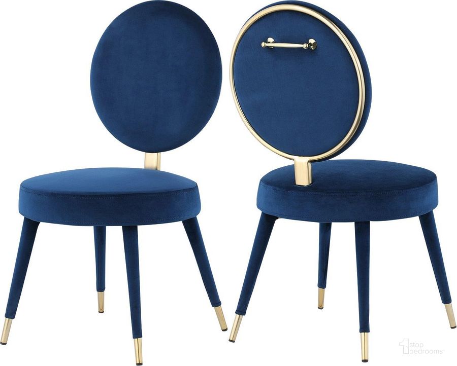 The appearance of Brandy Navy Velvet Dining Chair Set Of 2 designed by Meridian in the modern / contemporary interior design. This navy velvet piece of furniture  was selected by 1StopBedrooms from Brandy Collection to add a touch of cosiness and style into your home. Sku: 580Navy-C. Product Type: Dining Chair. Material: Iron. Image1
