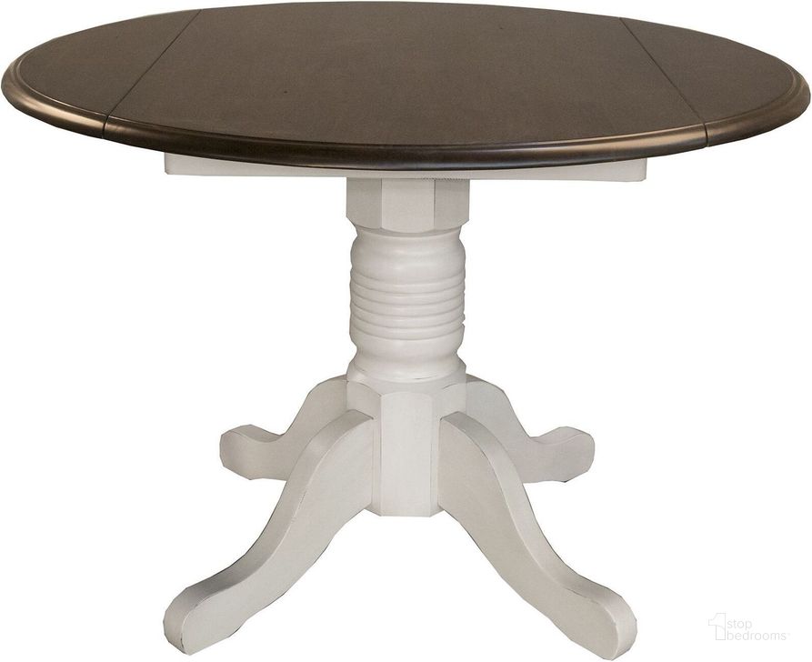 The appearance of British Isles Chalk Cocoa Bean 42" Extendable Round Dining Table designed by A-America in the transitional interior design. This white piece of furniture  was selected by 1StopBedrooms from British Isles Collection to add a touch of cosiness and style into your home. Sku: BRICO610B;BRICO610T. Table Base Style: Pedestal. Table Top Shape: Round. Product Type: Dining Table. Material: Rubberwood. Image1