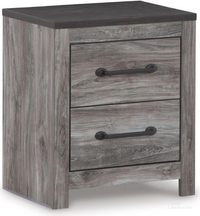 The appearance of Bronyan Dark Gray Nightstand designed by Signature Design by Ashley in the modern / contemporary interior design. This dark gray piece of furniture  was selected by 1StopBedrooms from Bronyan Collection to add a touch of cosiness and style into your home. Sku: B1290-92. Material: Wood. Product Type: Nightstand. Image1