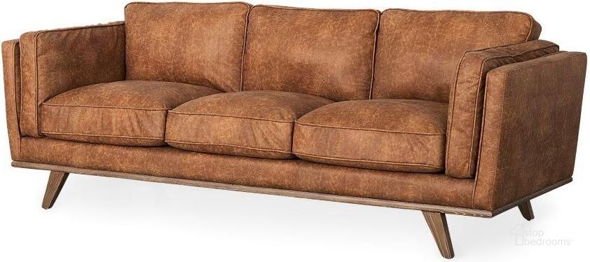 The appearance of Brooks Cognac Brown Faux Leather Three Seater Sofa With Medium Brown Wooden Legs designed by Mercana in the modern / contemporary interior design. This brown piece of furniture  was selected by 1StopBedrooms from Brooks Collection to add a touch of cosiness and style into your home. Sku: 69619. Material: Wood. Product Type: Sofa. Image1