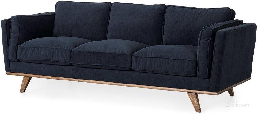 The appearance of Brooks Navy Blue Fabric Three Seater Sofa With Medium Brown Wooden Legs designed by Mercana in the modern / contemporary interior design. This blue piece of furniture  was selected by 1StopBedrooms from Brooks Collection to add a touch of cosiness and style into your home. Sku: 69621. Material: Wood. Product Type: Sofa. Image1