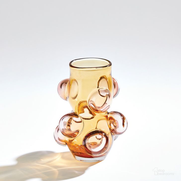 The appearance of Bubbled Small Vase In Amber Blush designed by Global Views in the modern / contemporary interior design. This orange piece of furniture  was selected by 1StopBedrooms from Bubbled Collection to add a touch of cosiness and style into your home. Sku: 6.60603. Material: Glass. Product Type: Vase. Image1