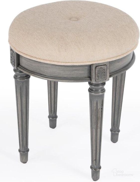 The appearance of Butler Bernadette Grey Upholstered Vanity Stool designed by Butler Specialty Company in the transitional interior design. This grey piece of furniture  was selected by 1StopBedrooms from Bernadette Collection to add a touch of cosiness and style into your home. Sku: 1250418. Product Type: Vanity Stool. Material: Rubberwood. Image1