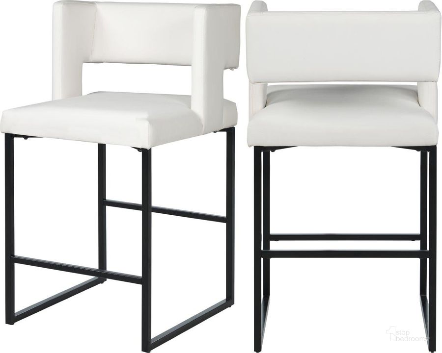 The appearance of Caleb White Faux Leather Counter Stool 970White-C Set of 2 designed by Meridian in the modern / contemporary interior design. This white piece of furniture  was selected by 1StopBedrooms from Caleb Collection to add a touch of cosiness and style into your home. Sku: 970White-C. Material: Faux Leather. Product Type: Barstool. Image1