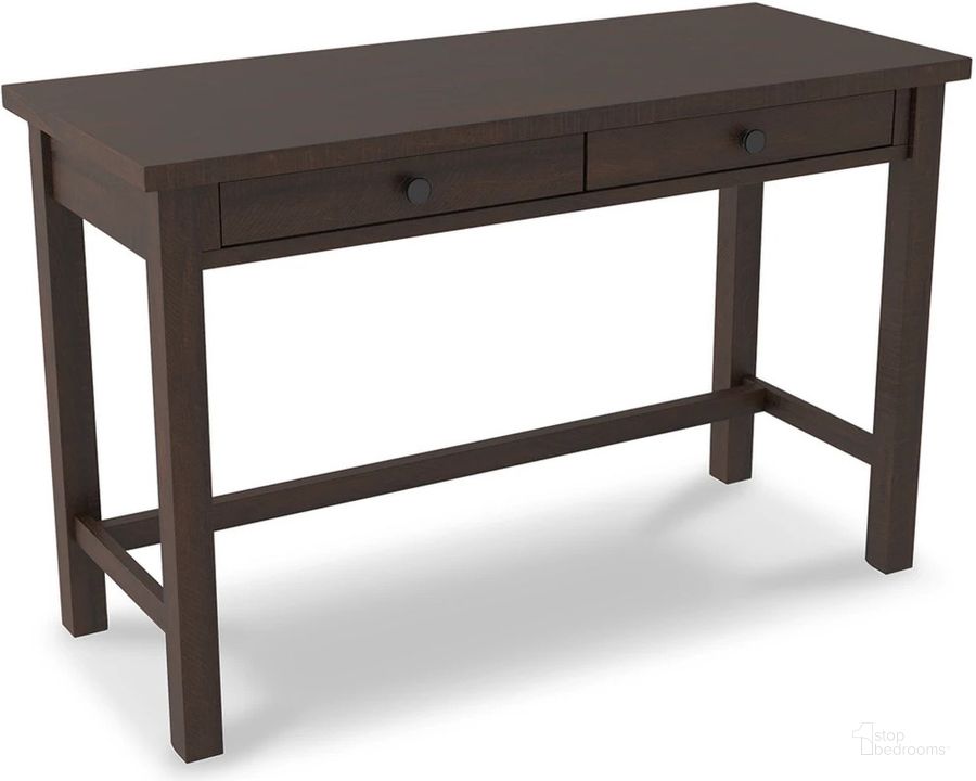 The appearance of Camiburg Warm Brown 47 Inch Trestle Home Office Desk designed by Signature Design by Ashley in the transitional interior design. This warm brown piece of furniture  was selected by 1StopBedrooms from Camiburg Collection to add a touch of cosiness and style into your home. Sku: H283-14. Material: Wood. Product Type: Home Office Desk. Image1