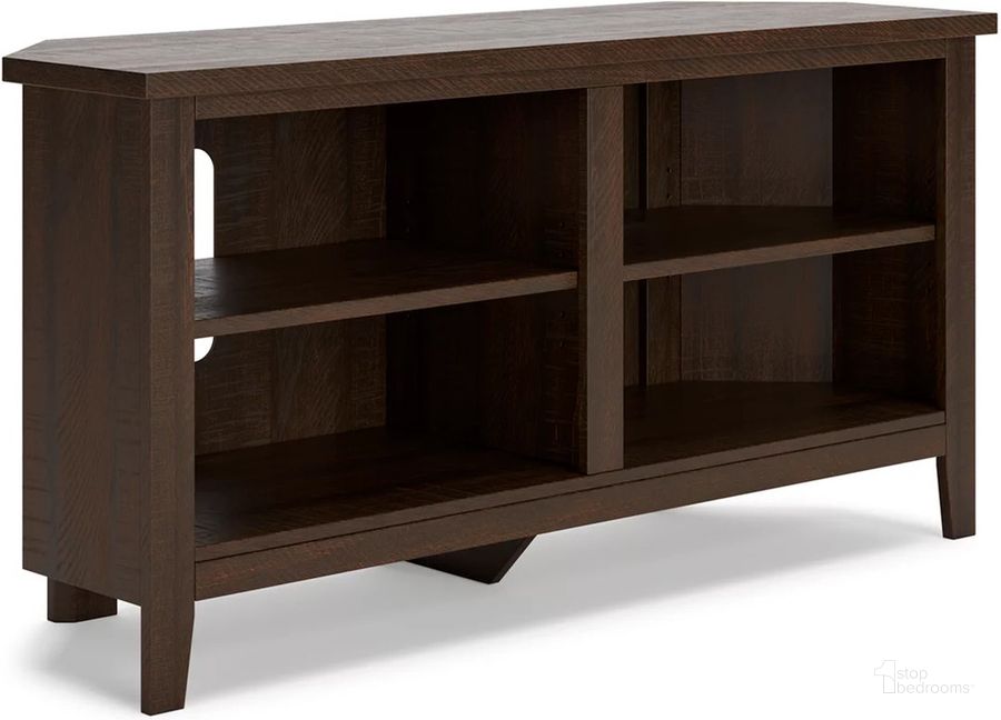 The appearance of Camiburg Warm Brown Small Corner Tv Stand designed by Signature Design by Ashley in the transitional interior design. This warm brown piece of furniture  was selected by 1StopBedrooms from Camiburg Collection to add a touch of cosiness and style into your home. Sku: W283-46. Material: Wood. Product Type: TV Stand. Image1